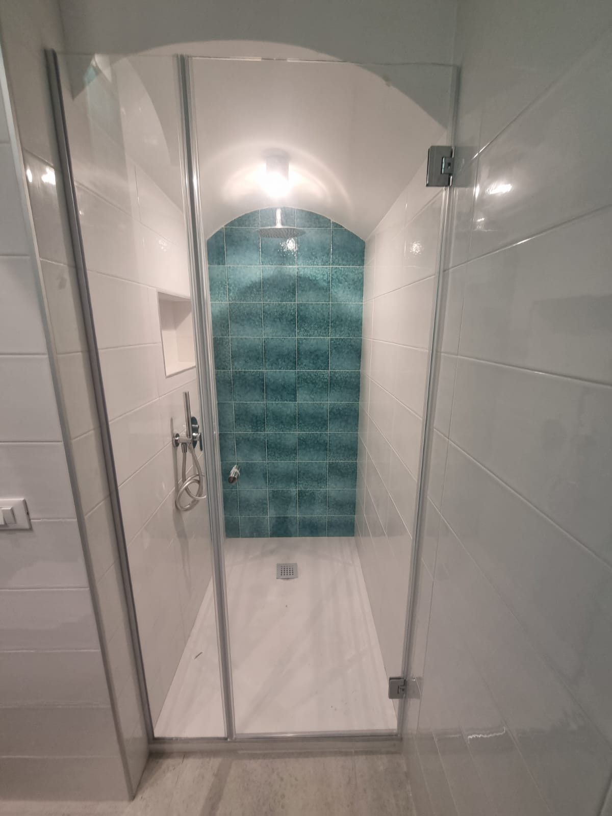 Studio Terra shower with teal tile